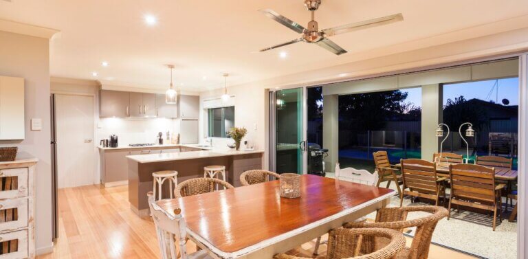 A modern-looking kitchen with the lights turned on.